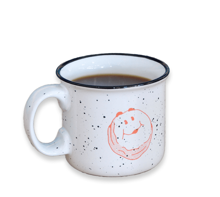 Cut out picture of a black coffee in a speckled, branded Biscuit Belly mug
