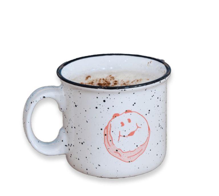 Cut out picture of a latte in a speckled Biscuit Belly branded mug