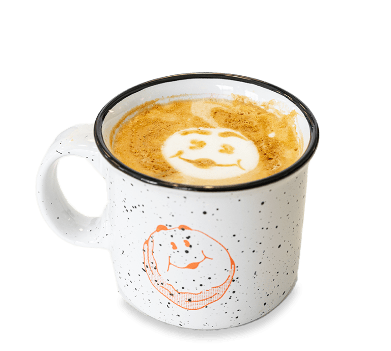 Picture of a latte with the Biscuit Belly mascot in latte art on top