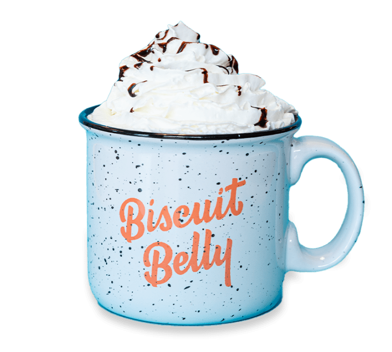 Cut out picture of a Biscuit Belly mug topped with whipped cream and chocolate sauce