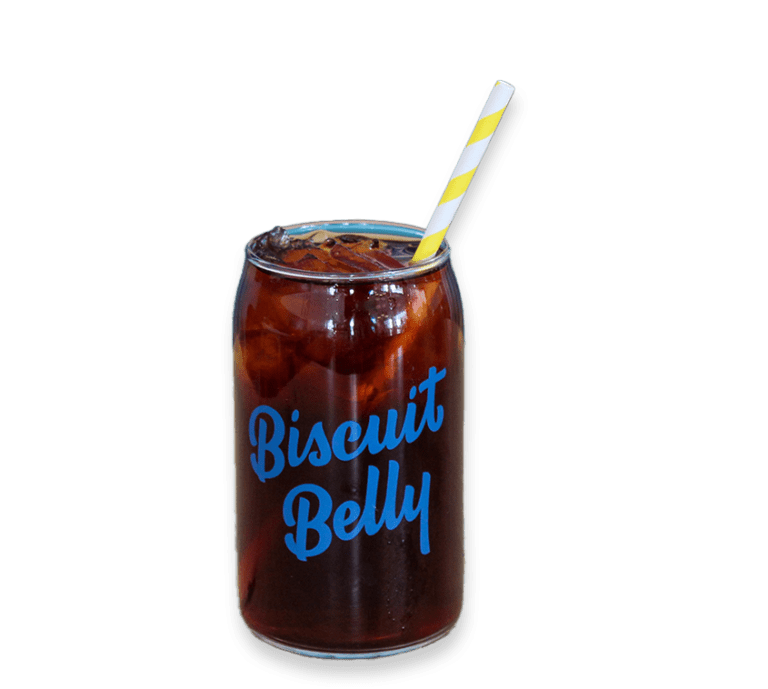 Cut out picture of a black iced coffee in a branded Biscuit Belly glass with a yellow and white striped straw