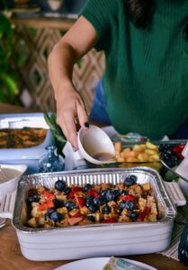 Pouring syrup to our popular French Toast Bake